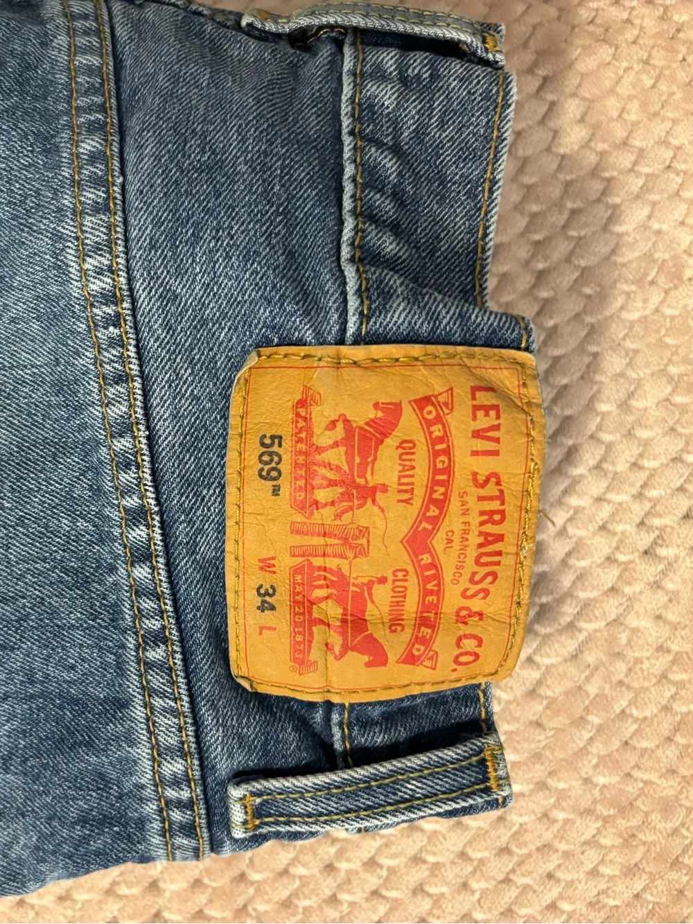 Levi's blue denim jean shorts 526 with tan leather patch